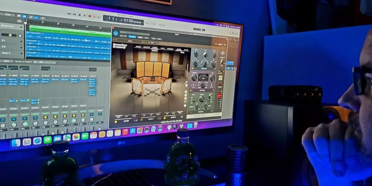 Man on computer using UAD Plugin